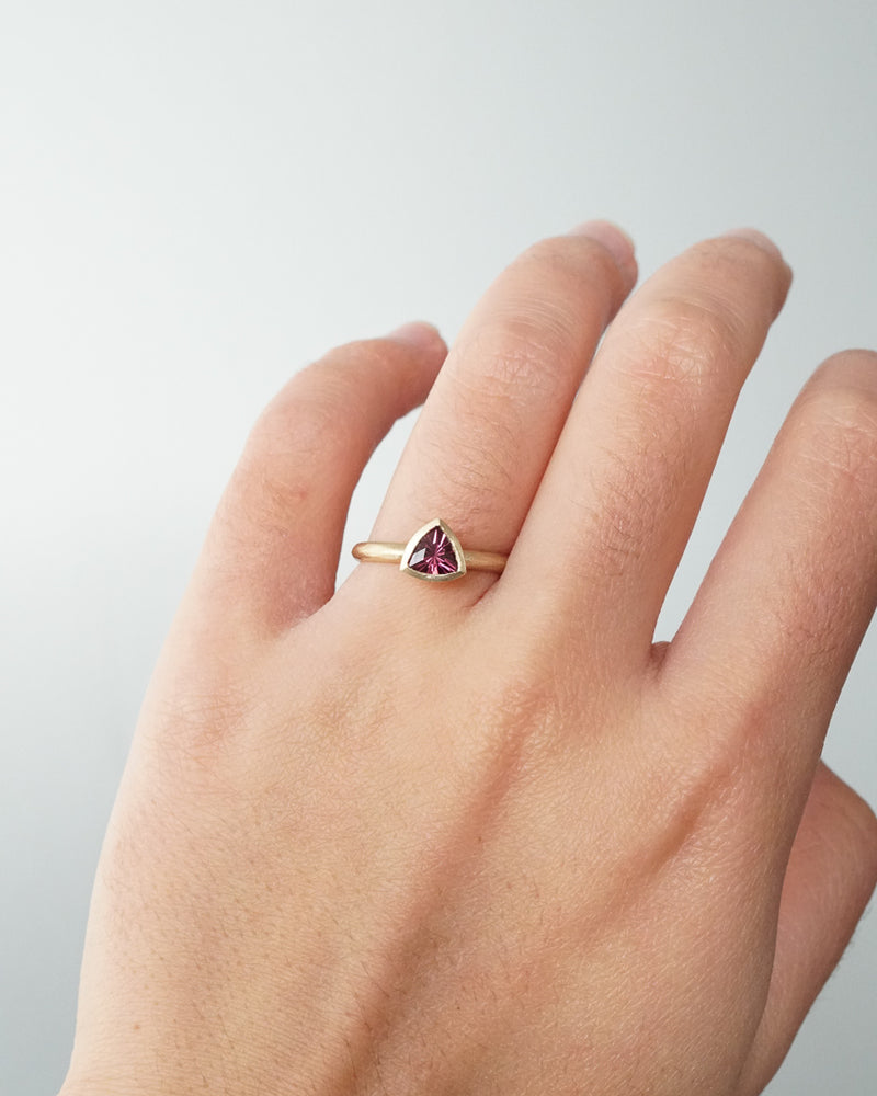 Shown: A grandmother's ring to her grand-daughter - a bright trillion shaped stone to represent the uniqueness of the child. 