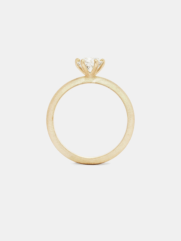 Classic Solitaire with 0.75ct near colorless antique diamond in 14k yellow gold with organic texture and signature matte finish.