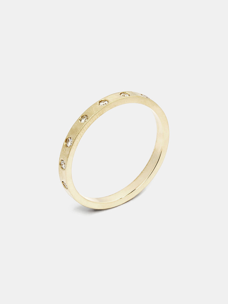 Fern Eternity Band in 14k yellow gold with 1.5mm recycled diamonds and antique hammer texture and signature matte finish. 