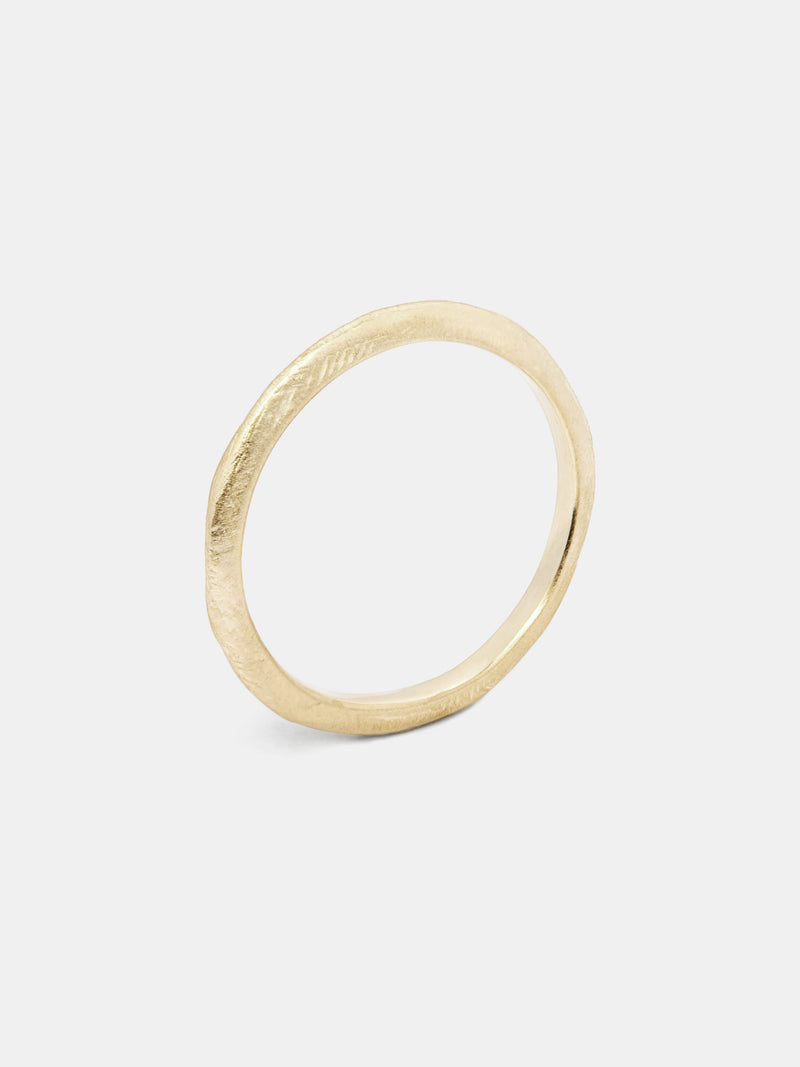 Knife Band- 2.5mm in 14k yellow gold with organic texture and signature matte finish. 