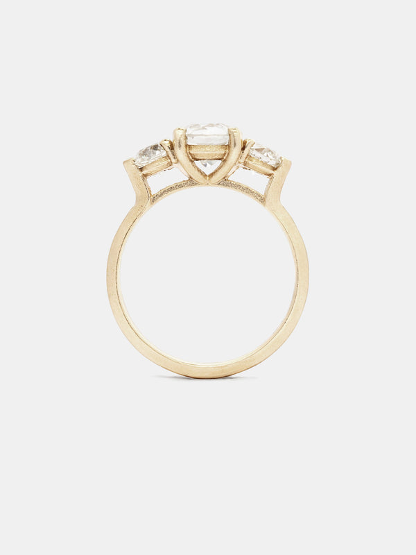 Trillium Ring with 1ct near colorless antique center stone and 0.3ct near colorless antique side stones in 14k yellow gold with organic texture and signature matte finish.