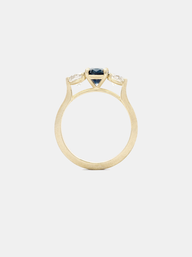 Shown: 1ct cobalt Montana sapphire with 0.3ct antique side stones in 14k yellow gold with organic texture and signature matte finish.