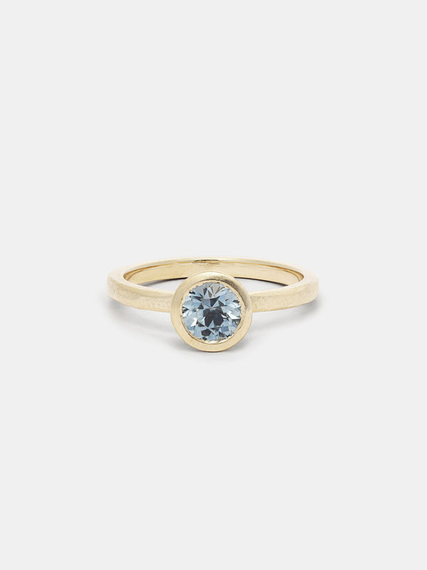 Shown: 1ct aqua Montana sapphire in 14k yellow gold with organic texture and signature matte finish.