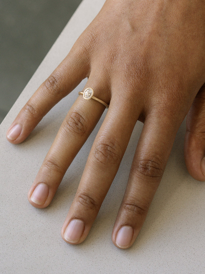 Shown: 0.5ct colorless recycled diamond in 14k yellow gold with organic texture and signature matte finish.